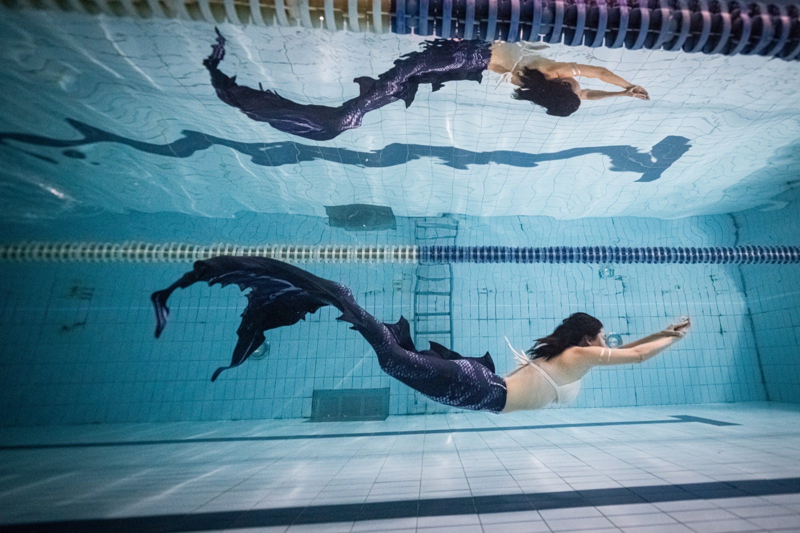 Freediving and mermaid photography in an indoor pool