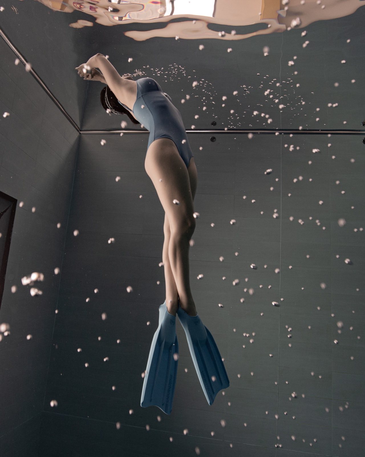 Freediving and mermaid photography in an indoor pool