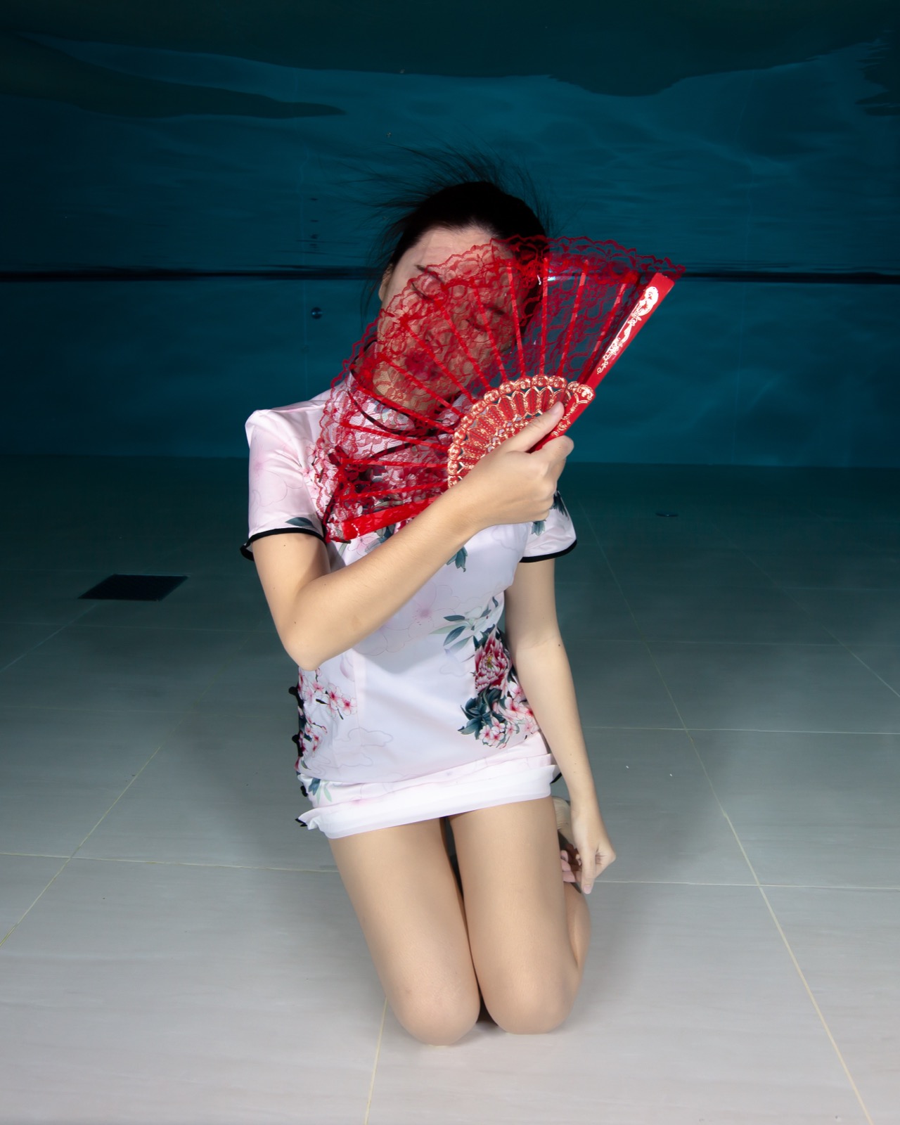 Freediving and mermaid photography in an indoor pool