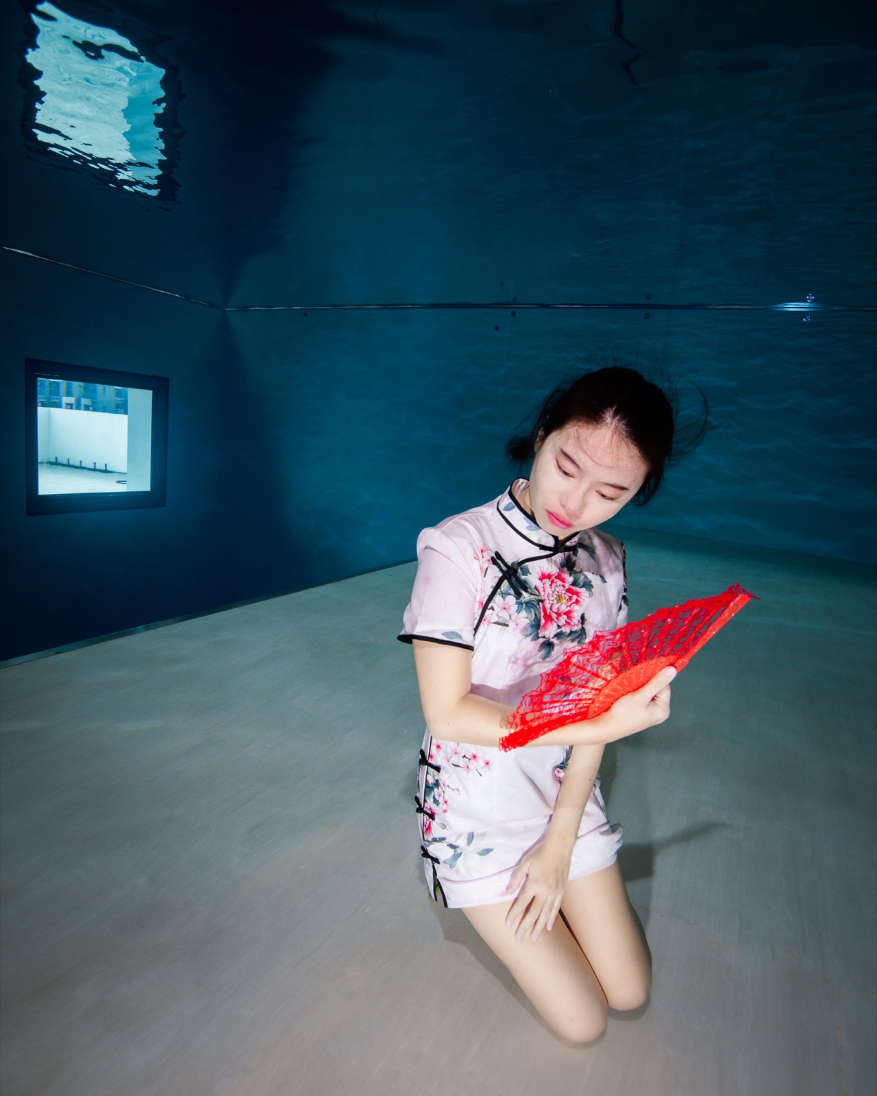Freediving and mermaid photography in an indoor pool