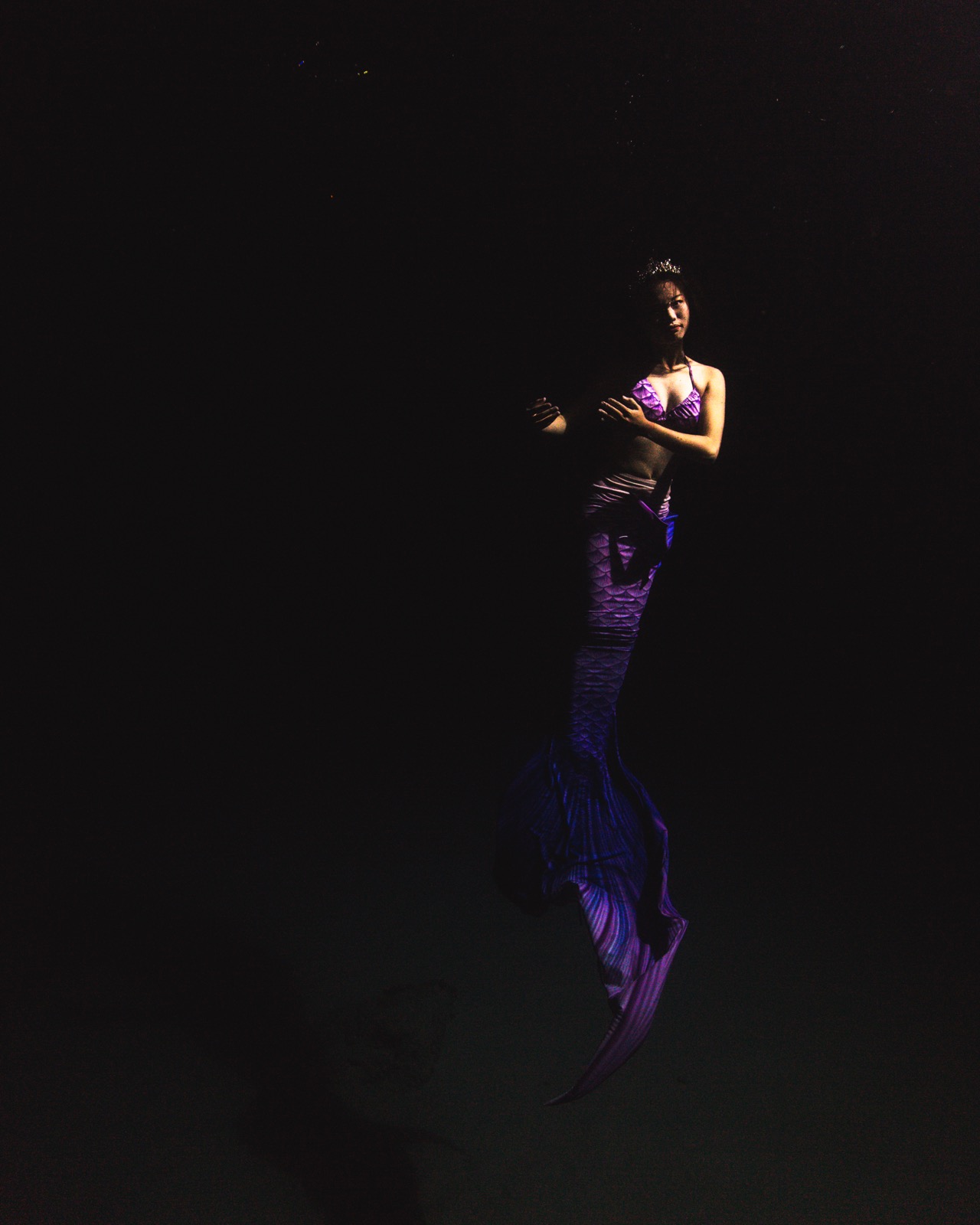 Freediving and mermaid photography in an indoor pool