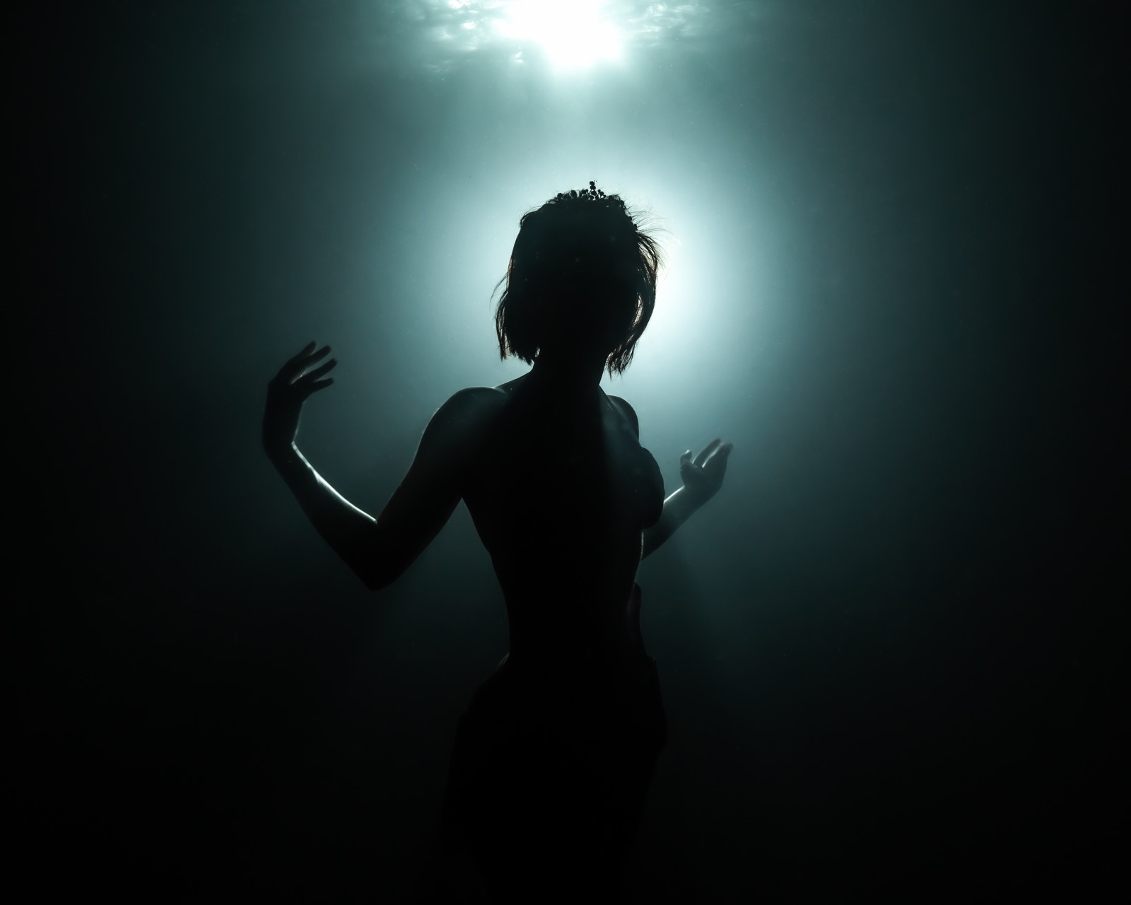 Freediving and mermaid photography in an indoor pool
