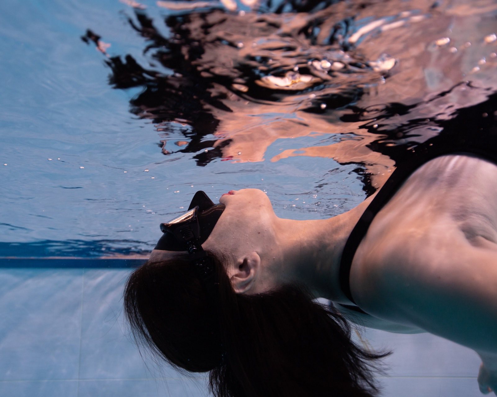 Freediving and mermaid photography in an indoor pool